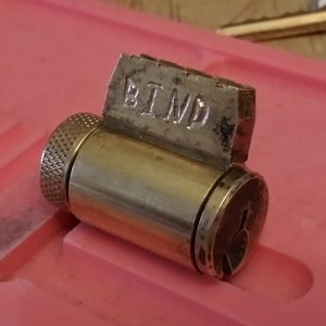 KIK cylinder with BIND engraved