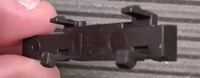 Bearing retainer cover back, showing tab clips